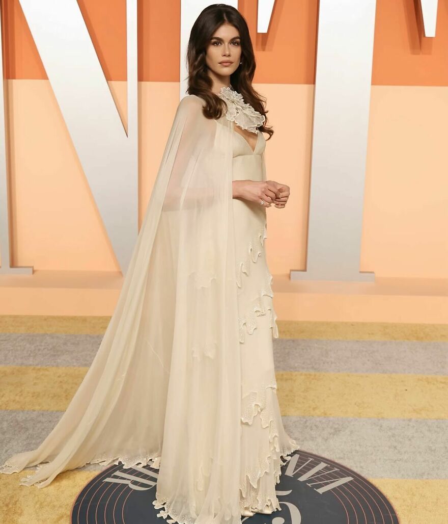 Kaia Gerber dressed in an elegant cream gown with cape, representing nepo babies shaping Hollywood’s new generation. Kaia Gerber dressed in an elegant cream gown with cape, representing nepo babies shaping Hollywood’s new generation.
