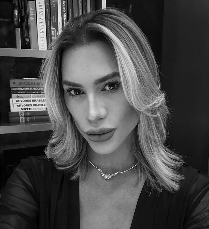 Black and white portrait of a woman with styled hair, highlighting complications from popular fox eyes surgery risks. Black and white portrait of a woman with styled hair, highlighting complications from popular fox eyes surgery risks.