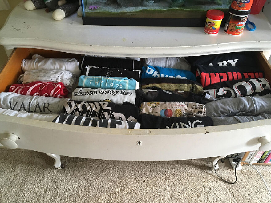 drawer neatly organized with folded clothes, demonstrating effective organization hacks for home storage solutions