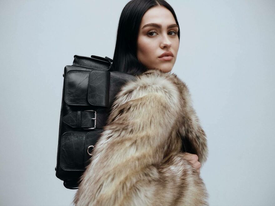 Amelia Gray in a fur coat carrying a black leather backpack, representing nepo babies defining Hollywood’s new generation. Amelia Gray in a fur coat carrying a black leather backpack, representing nepo babies defining Hollywood’s new generation.