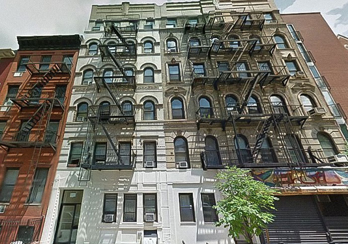 Old apartment building with fire escapes, related to David Harbour's viral interaction with a woman half his age. Old apartment building with fire escapes, related to David Harbour's viral interaction with a woman half his age.