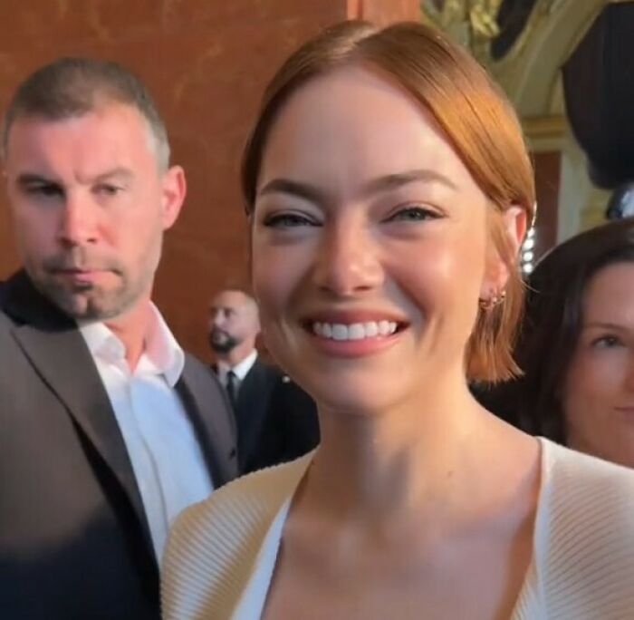 Emma Stone smiling at an event, sparking plastic surgery speculation in Louis Vuitton photos. Emma Stone smiling at an event, sparking plastic surgery speculation in Louis Vuitton photos.