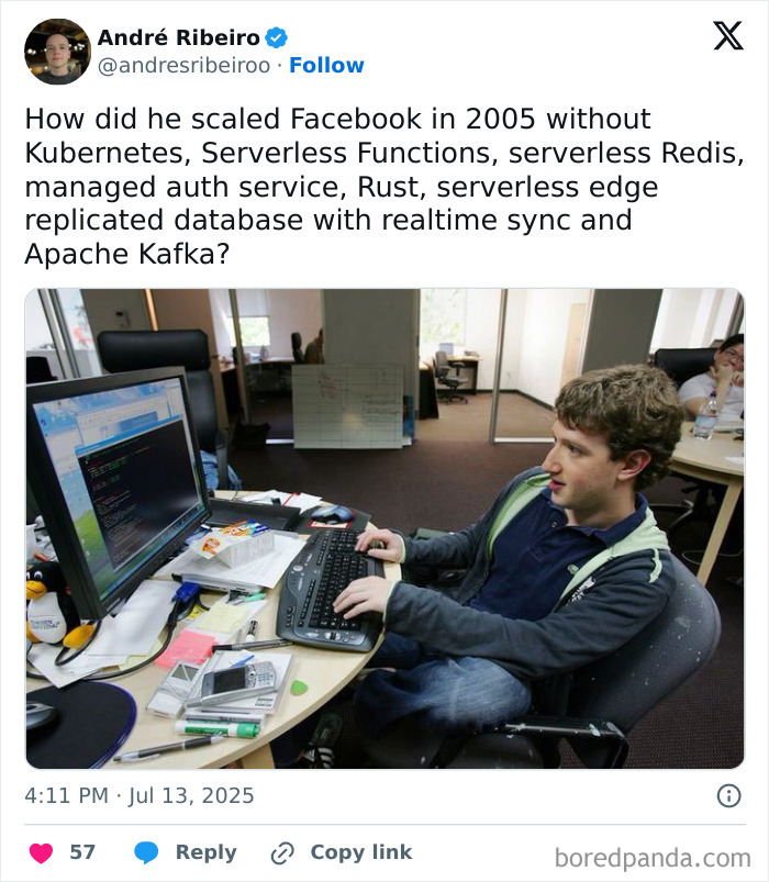 Young man coding on a desktop computer in an office, illustrating programming and computer science humor meme.