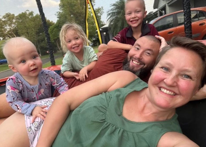 Family rushing out of rental house reacting with concern after making a disturbing discovery showing emotional urgency outdoors Family rushing out of rental house reacting with concern after making a disturbing discovery showing emotional urgency outdoors