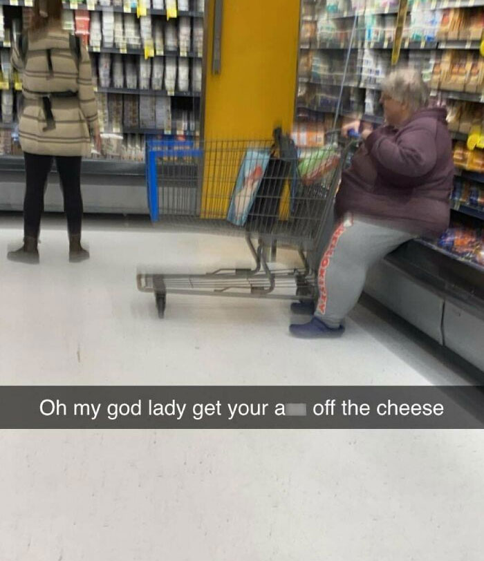 Woman sitting on shopping cart in aisle at Walmart cheese section, illustrating wildest People of Walmart moments