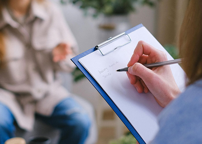 Mental health myths being debunked by psychologist during a counseling session with a patient in a casual setting.