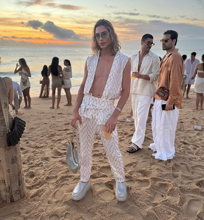 Influencer at beach event wearing stylish outfit, highlighting complications from popular fox eyes surgery concerns. Influencer at beach event wearing stylish outfit, highlighting complications from popular fox eyes surgery concerns.