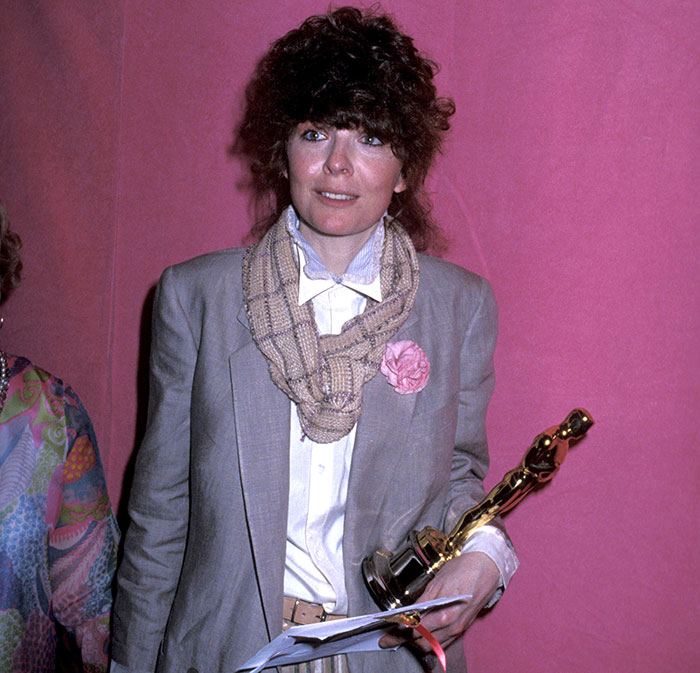 Diane Keaton holding an Oscar statue, with a scarf and gray blazer, representing chilling detail of last moments revealed in 911 call. Diane Keaton holding an Oscar statue, with a scarf and gray blazer, representing chilling detail of last moments revealed in 911 call.