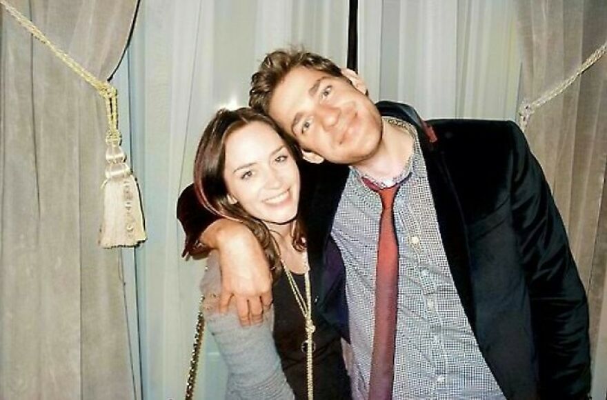 Emily Blunt And John Krasinski smiling and embracing indoors, illustrating the secret formula behind enduring relationships.