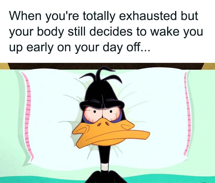 Exhausted cartoon duck with tired eyes illustrating relatable work memes about waking up early on a day off.