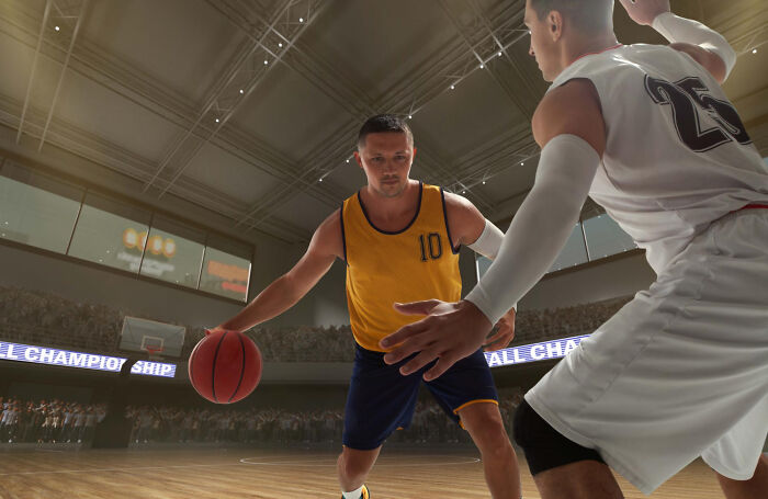 Two basketball players competing intensely on the court, highlighting risks of terrifying medical conditions without symptoms.