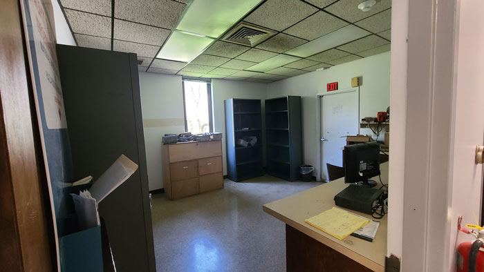 Office space with old furniture and computer being cleaned out after deceased coworker's grime buildup. Office space with old furniture and computer being cleaned out after deceased coworker's grime buildup.