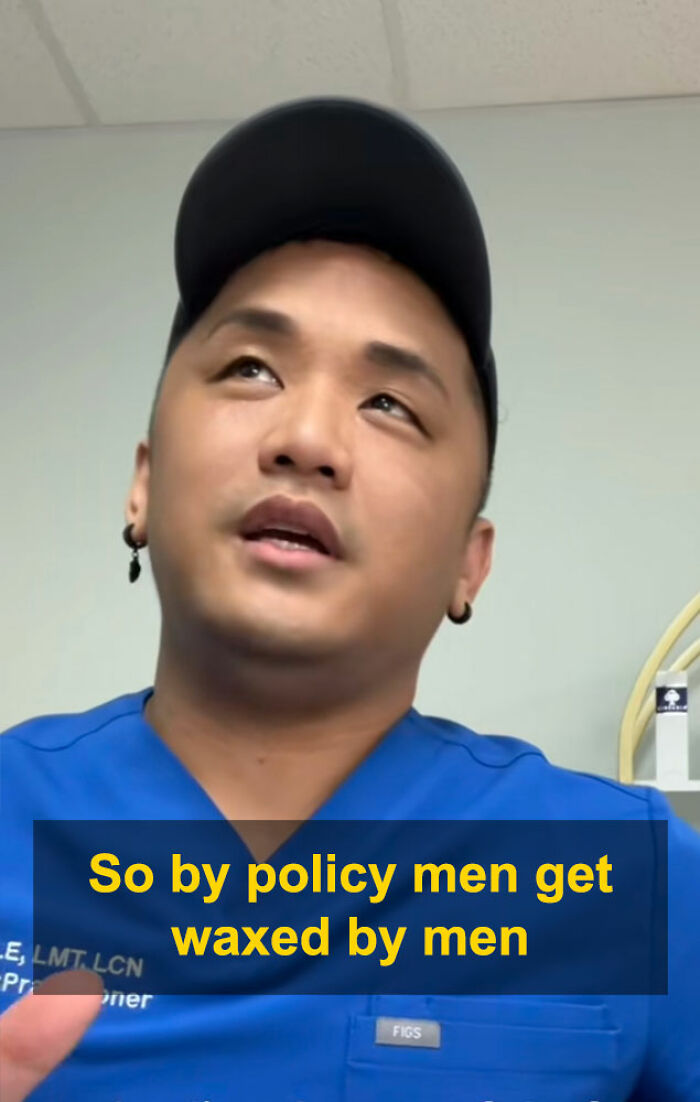 Aesthetician in blue scrubs explaining interaction about waxing policy in a clinical setting with a neutral background. Aesthetician in blue scrubs explaining interaction about waxing policy in a clinical setting with a neutral background.