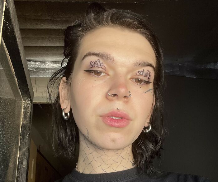 Person with facial tattoos and piercings, showcasing unique ink as tattoo artists drew the line with certain requests.