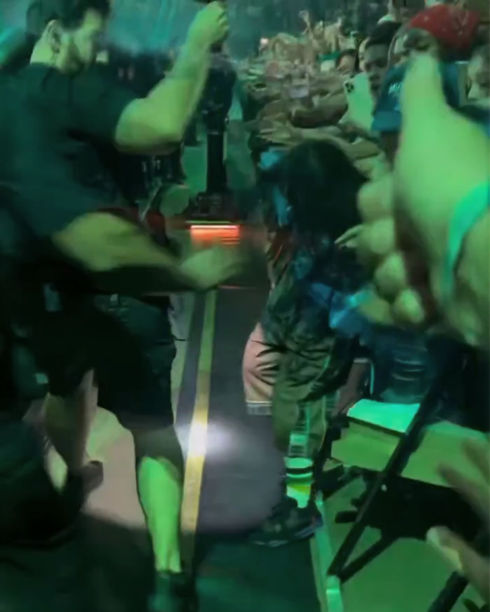 Crowd and security at a Billie Eilish Miami concert reacting as a man tries to snatch the singer backstage. Crowd and security at a Billie Eilish Miami concert reacting as a man tries to snatch the singer backstage.