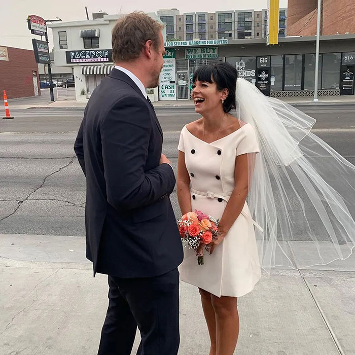 David Harbour and Lily Allen smiling on a city sidewalk, amid fans clashing online over cheating and firing debates. David Harbour and Lily Allen smiling on a city sidewalk, amid fans clashing online over cheating and firing debates.