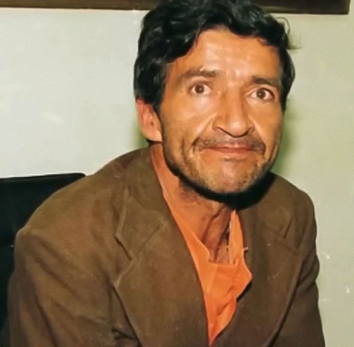 Man with dark hair and beard wearing brown jacket, related to monster who strangled over 100 young girls recently freed. Man with dark hair and beard wearing brown jacket, related to monster who strangled over 100 young girls recently freed.