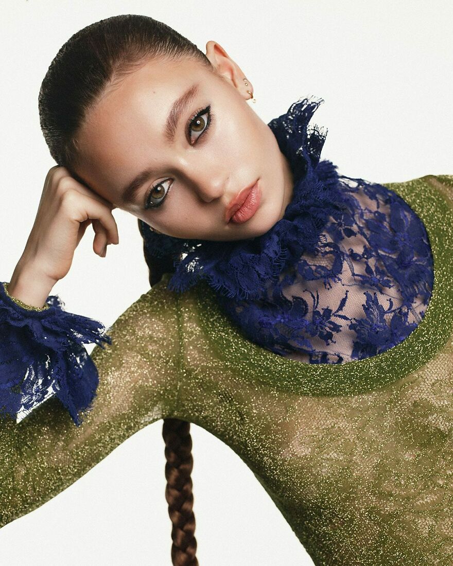 Nico Parker with braided hair wearing green and blue lace outfit representing nepo babies in Hollywood’s new generation.