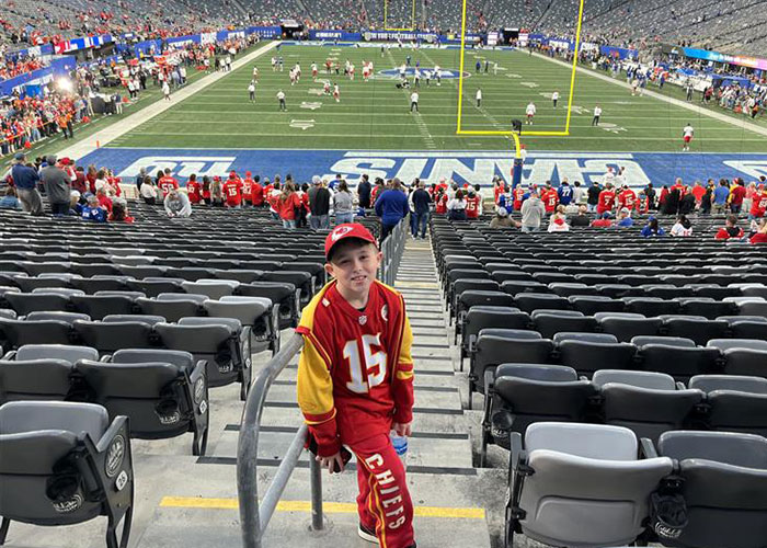 Young Kansas City Chiefs fan at stadium, related to viral Kansas City Karen headband incident involving 10-year-old boy. Young Kansas City Chiefs fan at stadium, related to viral Kansas City Karen headband incident involving 10-year-old boy.