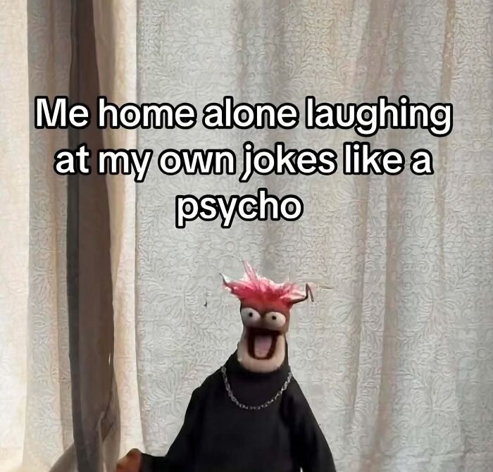 Introvert meme showing a puppet with red hair laughing alone at home, highlighting introvert humor and social decompression.