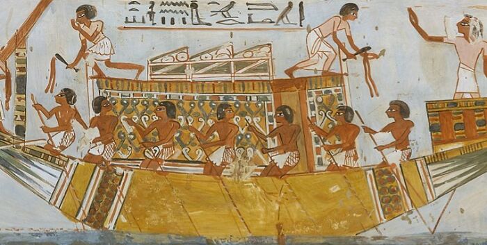 Ancient Egyptian illustration showing a group of men rowing a large boat, highlighting unsafe historical sports activities.