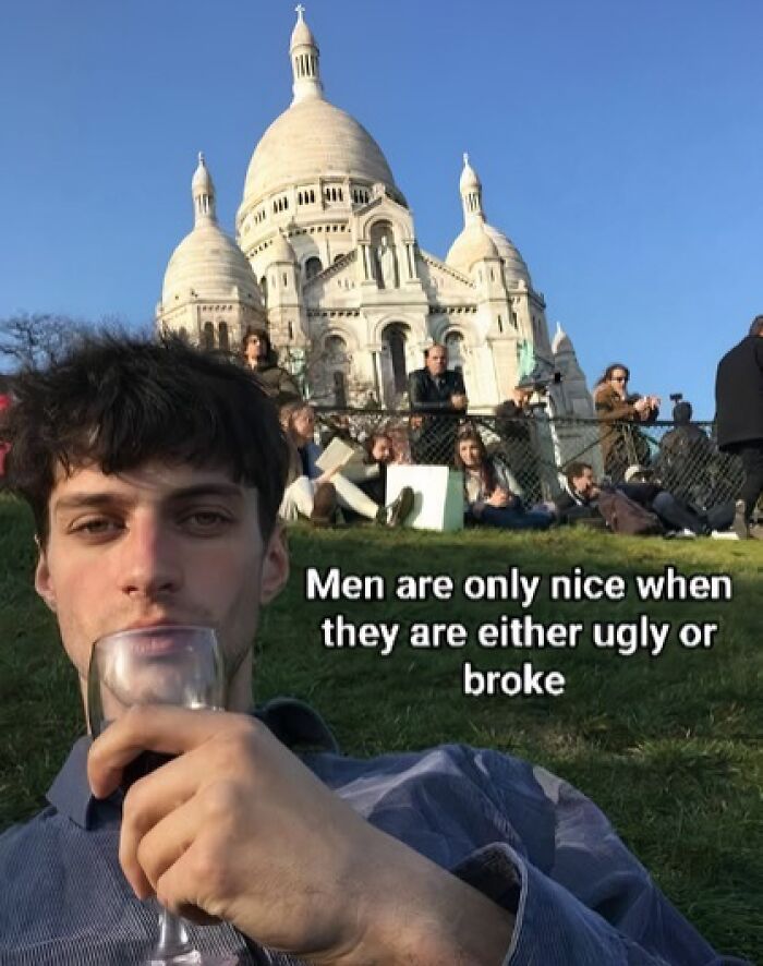 Young man drinking from a glass in front of a historic building with an unhinged meme about evil thoughts visible.