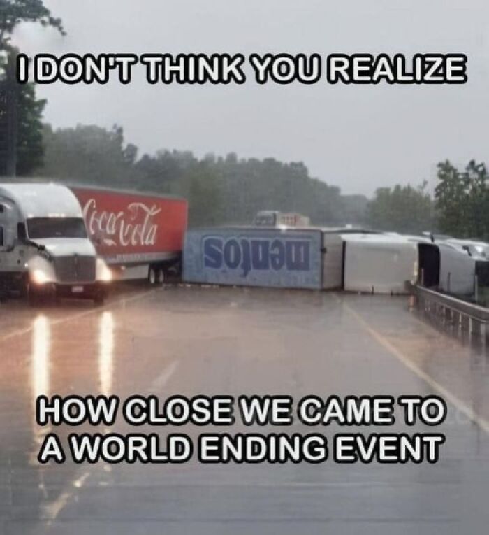 Overturned Coca-Cola and Mentos trucks on a rainy highway illustrating a near world-ending event meme.