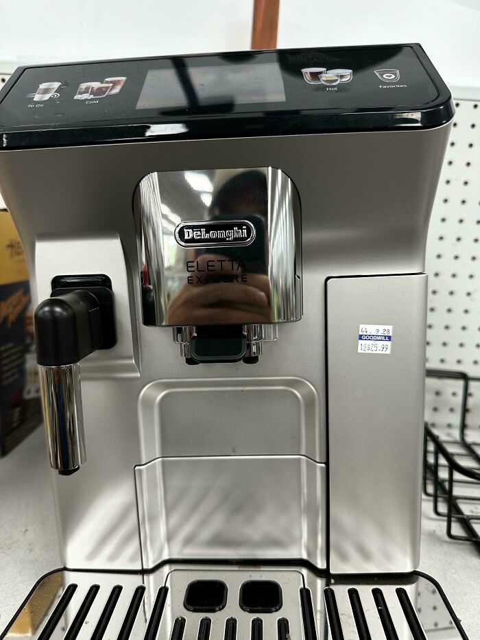 DeLonghi Eletta coffee machine found at thrift store with a Goodwill price tag showing thrift store jackpot find.