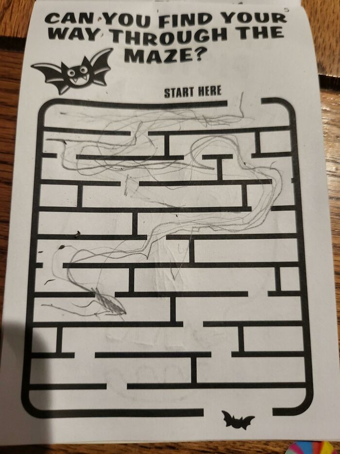 Hand-drawn maze with scrambled lines on Halloween-themed activity sheet showing Halloween fails.