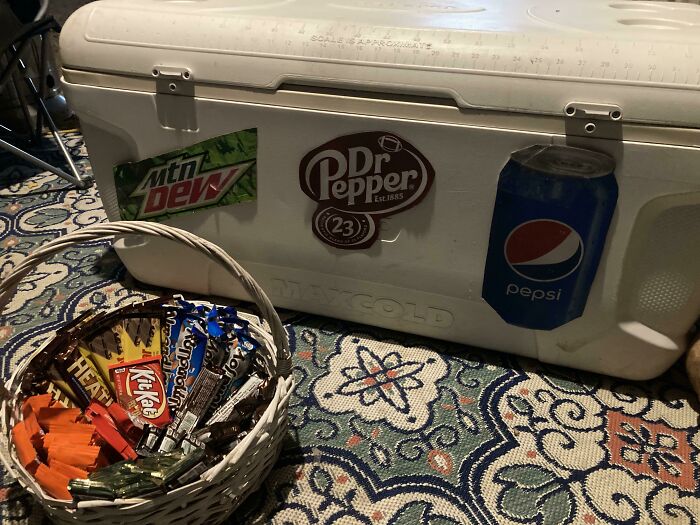 Basket filled with Halloween candy next to a cooler, illustrating Halloween fails during the spookiest day of the year.