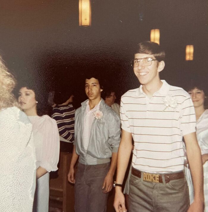 Group of teenagers dressed in 1980s style clothing at a social event, showcasing wild and wonderful fashion trends.