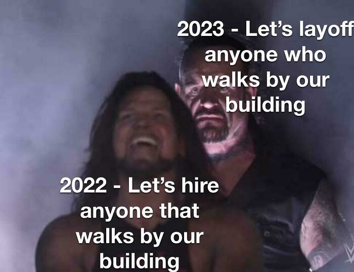Two wrestlers with text contrasting 2022 hiring anyone walking by with 2023 laying off anyone walking by, funny layoffs meme.