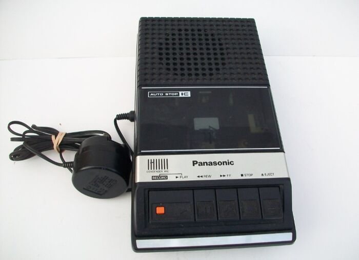 Vintage Panasonic cassette recorder with buttons and power adapter, nostalgic device that makes people who recognize it feel very old.