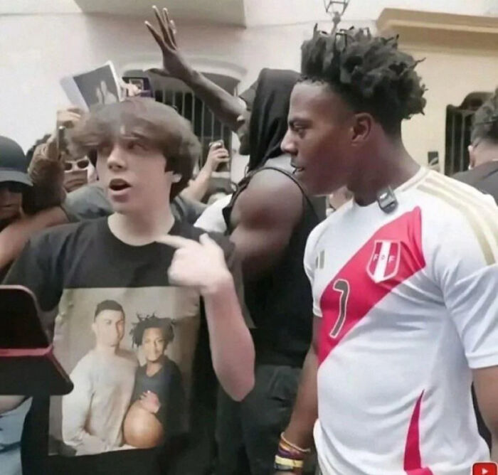 A group of people laughing and engaging in a lively moment captured in funny pictures that go hard.