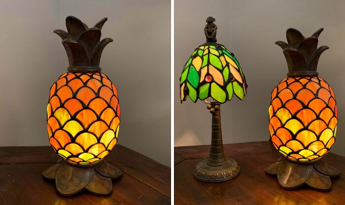 Stained glass pineapple lamp and vintage green leaf lamp on wooden table, perfect thrift store jackpot finds.