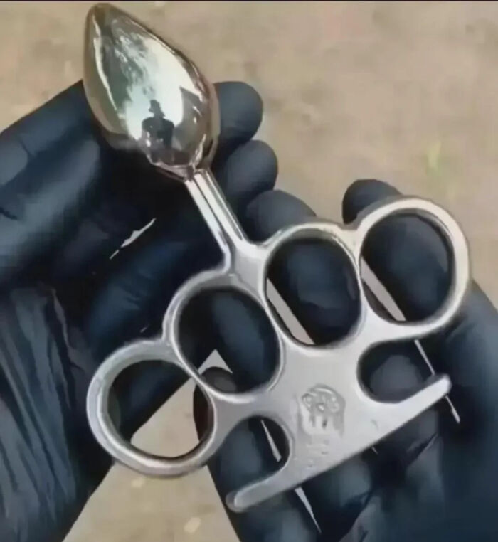 Person wearing black gloves holding a metal knuckle duster with a pointed end among pictures that go hard.