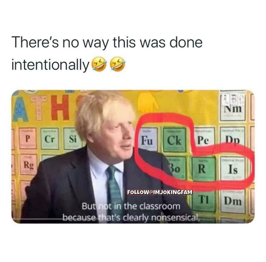 Man in suit standing by periodic table with letters circled to form a humorous phrase, showing people knew exactly what they were doing.