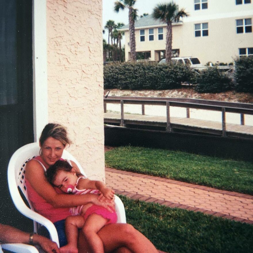 Woman sitting outside on a white chair holding a child, with greenery and buildings in the background, illustrating Addison Rae net worth. Woman sitting outside on a white chair holding a child, with greenery and buildings in the background, illustrating Addison Rae net worth.