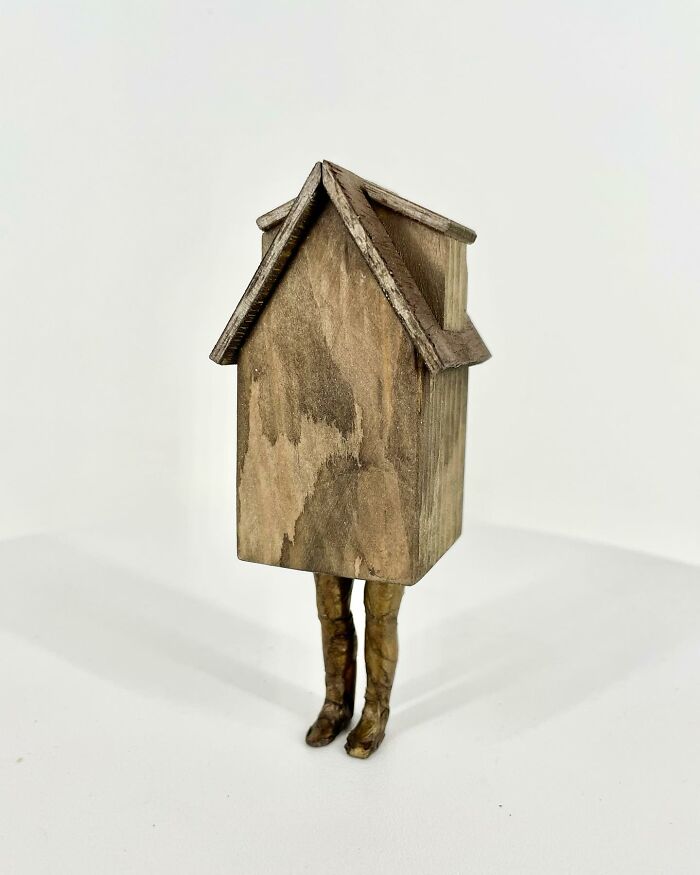 Surreal collage of a wooden building with human legs, blending architecture and walking elements in an imaginative artwork.