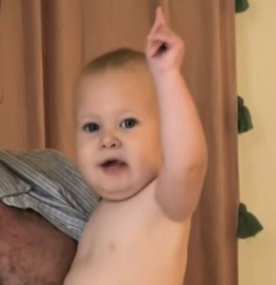 Baby making a shocked gesture with raised finger, illustrating 2024 pop culture moments that surprised viewers.