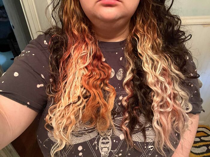 Person with curly hair showing a hair color mishap featuring uneven and mixed blonde and brown shades as hair accidents.