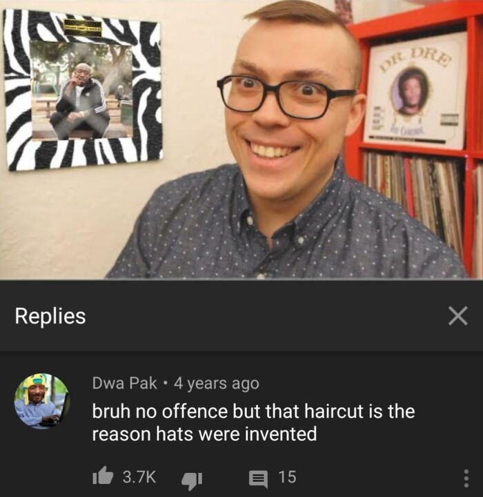 Man with awkward haircut smiling indoors, highlighting a hilariously tragic hair accident with glasses and a polka dot shirt.