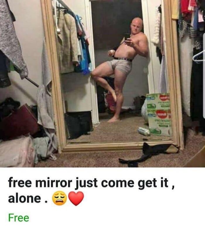 Man posing in underwear taking selfie in large mirror, showing hilarious reflection that sells the mirror.