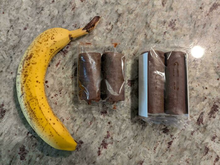 Banana placed next to chocolate-covered snacks in misleading packaging showing smaller portion sizes.