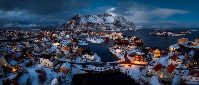 Snow-covered coastal village at dusk showcased in stunning panoramic masterpiece from Epson Pano Awards 2025.