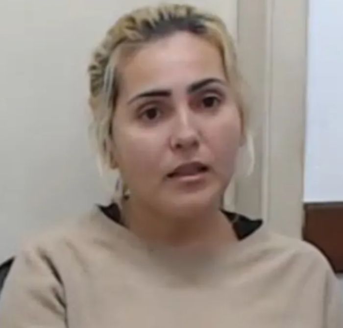 Woman with a serious expression, appearing in an interview related to angel-faced serial criminal case. Woman with a serious expression, appearing in an interview related to angel-faced serial criminal case.