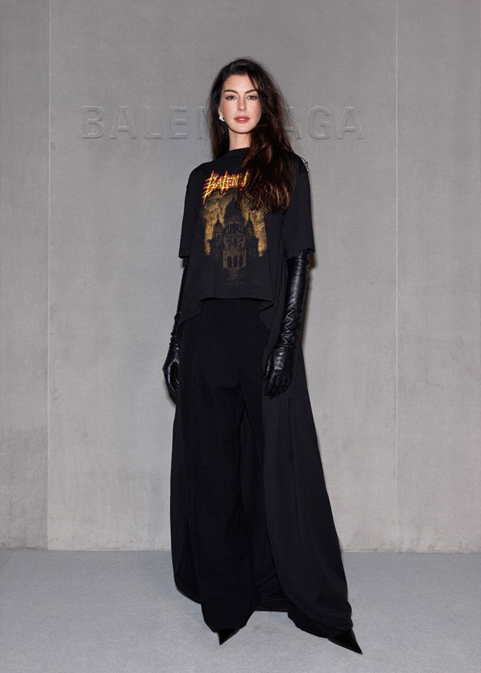 Woman in black Balenciaga outfit with long gloves and graphic tee, showcasing celebrity looks at Paris Fashion Week 2025. Woman in black Balenciaga outfit with long gloves and graphic tee, showcasing celebrity looks at Paris Fashion Week 2025.