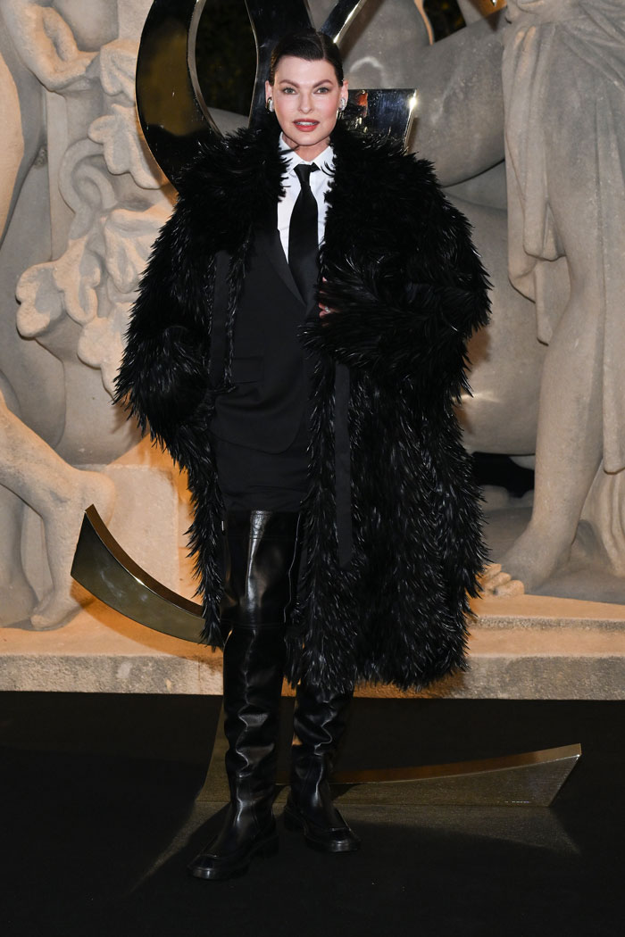 Celebrity in black fur coat and leather boots posing at Paris Fashion Week 2025 showcasing bold celebrity looks. Celebrity in black fur coat and leather boots posing at Paris Fashion Week 2025 showcasing bold celebrity looks.