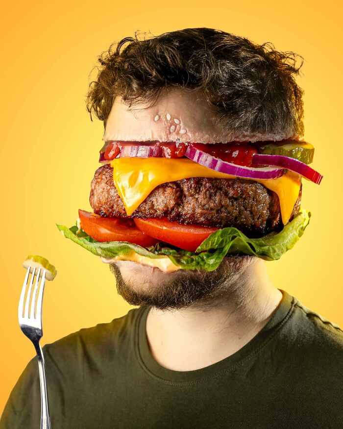 Man’s head blended with a cheeseburger in a surreal, logic-challenging photo manipulation art piece.