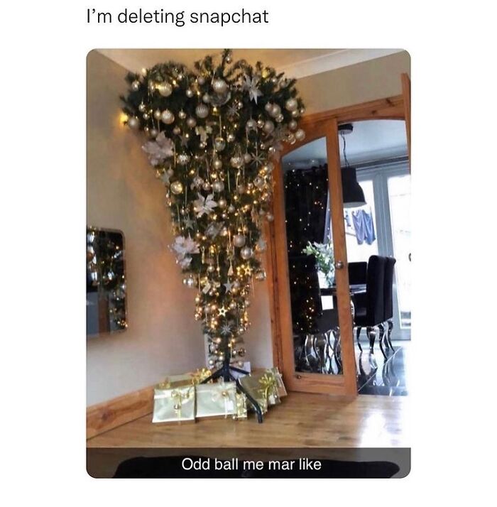 Upside down decorated Christmas tree with wrapped gifts and caption referencing unapologetically British meme humor.